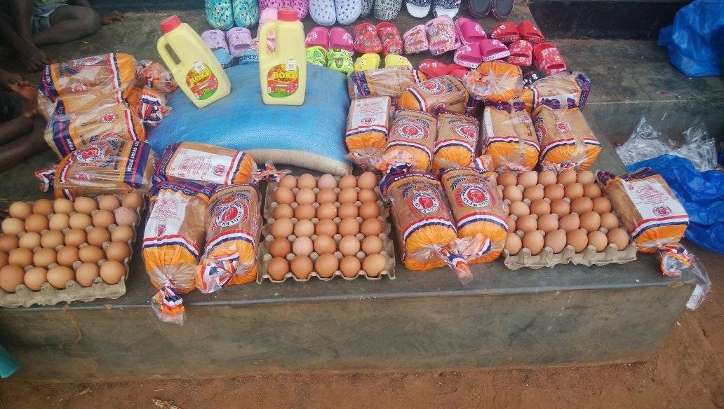 Bread, eggs, cooking oil and rows of new sandals laid out ready to be shared among the children